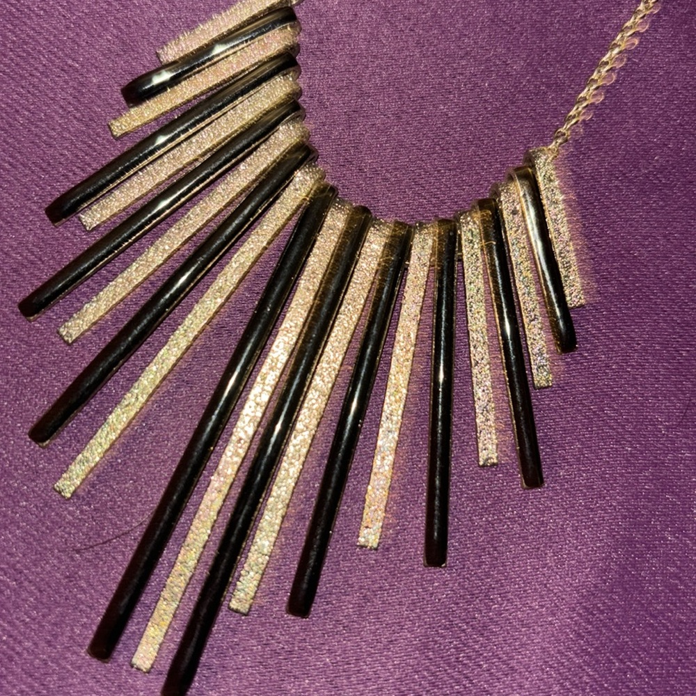 Gold and black chain necklace gold has flex of glitter in it